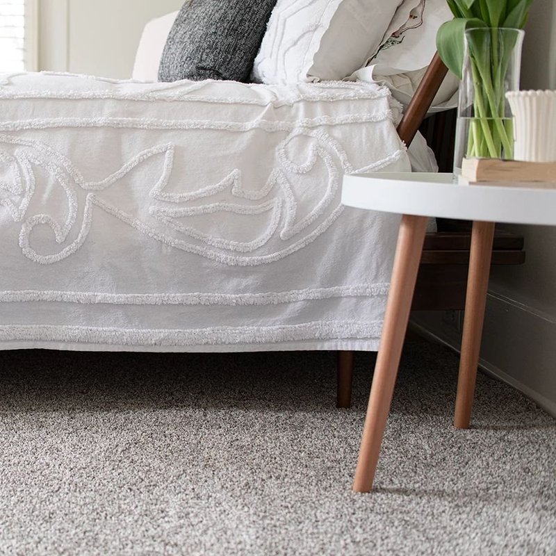 Bed and coffee table on the rug - Nantahala Flooring Outlet in Franklin, NC